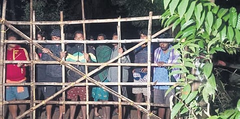 Villagers stand guard near a bamboo barricade in Dhinkia (Photo | Express
