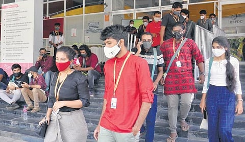 Delegates coming out of Kairali Sree Nila Theatre after a film screening on the first day of the 25th International Film Festival of Kerala in Thiruvananthapuram | Vincent Pulickal