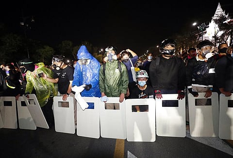 Pro-democracy protesters form a line as they try to march forward during a rally in Bangkok, Thailand. (Photo |AP)