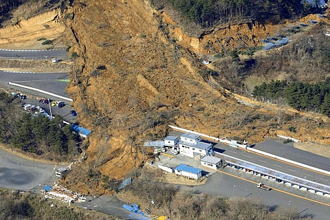 A landslide caused by a strong earthquake covers a circuit course in Nihonmatsu city, Fukushima prefecture, northeastern Japan. (Photo | AP)