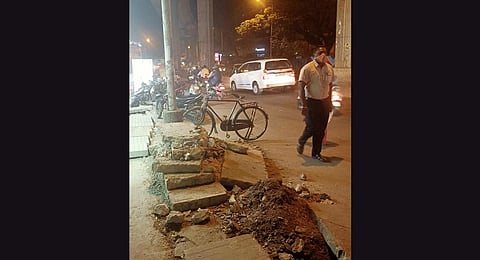 A dug-up footpath outside Halasuru Metro station.