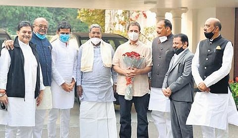 Former CM Siddaramaiah and others pose with Congress leader Rahul Gandhi in New Delhi on Tuesday
