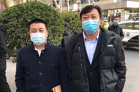 Chinese lawyer Ren Quanniu, left, stands with his attorney Bao Longjun (Photo | AP)