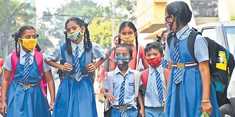 After schools for primary classes opened, children on their way to school in Vijayawada on Monday. (Photo | Prasant Madugula, EPS)