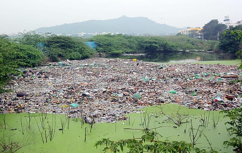Garbage dumped in the Putheri lake at Pallavaram- Thoraipakkam radial road. (File photo| Ashwin Prasath, EPS)