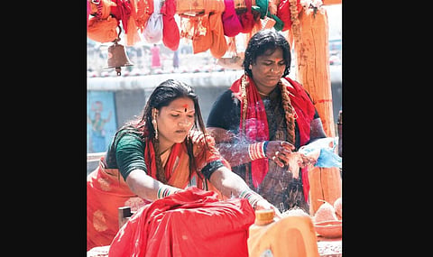 Devotees offer prayers at the Medaram temple on the occasion of Mini Sammakka-Saralamma Jatara, in Mulugu district.