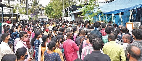 The crowd gathered in front of the residences of accident victims Sumesh and Vishal at Kudumbi Colony at Elamkulam in Kochi on Thursday when their bodies were brought there | Albin Mathew