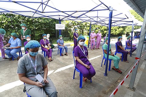 In this Jan. 27, 2021, file photo, Health workers wait to receive the Covishield COVID-19 vaccine at the Ayeyarwaddy COVID treatment center in Yangon, Myanmar. (Photo | AP)