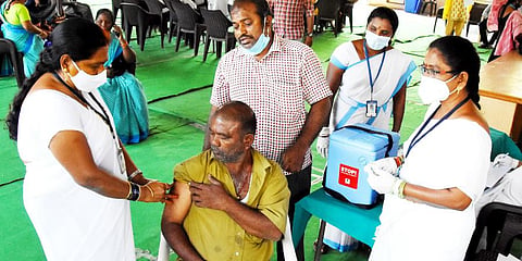 Municipal Corporation employess administering Covishield jab in Tirupati. (Photo | Madhav K)