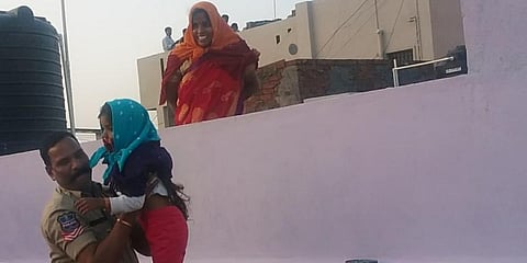 Head Conastable A Narshimulu with a child.