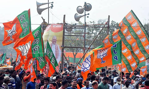 BJP workers gather during a public rally at Domurjala Stadium in Howrah district of West Bengal Sunday Jan. 31 2021. (Photo | PTI)