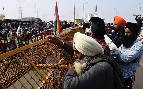 Farmers during their ongoing protest against Centres farm laws at Ghazipur border in New Delhi on Sunday Feb. 7 2021. (Photo | Parveen Negi/EPS)