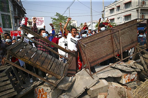 Protesters shout slogans as police arrive during a protest against the military coup in Mandalay, Myanmar, Sunday, Feb. 28, 2021. (Photo | AP)