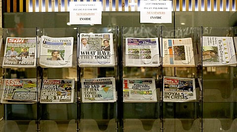 Newspapers headlining Prince Harry and Meghan’s explosive TV interview are displayed for sale outside a shop in London. (Photo | AP)