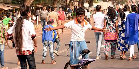 A boy performing bicycle stunt on Odisha's Janpath Road. (File Photo | EPS)
