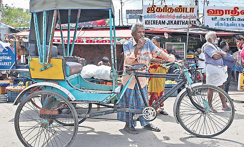A rider waiting for customers at Gandhi Market in Tiruchy on Wednesday | MK Ashok Kumar