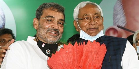 Bihar Chief Minister Nitish Kumar greeting RLSP president Upendra Kushwaha after he merged the party with JD(U). (Photo | ANI)