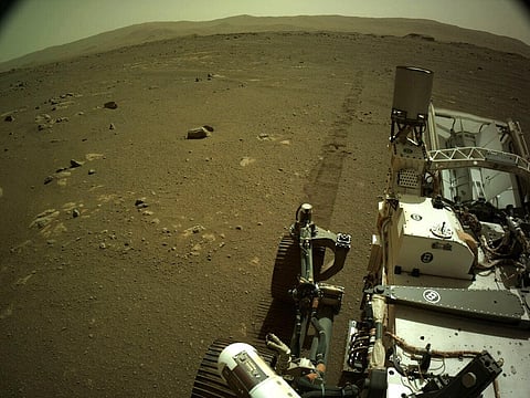 This Mar. 7, 2021 photo provided by NASA shows tire tracks left by the Mars Perseverance rover. (Photo | AP)