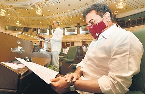 IT Minister KT Rama Rao studies the 2021 - 2022 Budget as Finance Minister T Harish Rao presents it in the Telangana Assembly on Thursdays