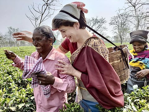 Congress General Secretary Priyanka Gandhi with estate workers at Sadhuru tea garden in Assam. (Photo | Twitter)