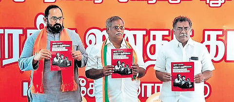 MP Rajeev Chandrasekhar and State General Secretary Embalam R Selvam releasing a ‘chargesheet’ against the V Narayanasamy government, in Puducherry | express