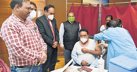 Krishna district collector A Md Imtiaz launches vaccination drive for airport staff at the Vijayawada International Airport on Tuesday. (Photo| EPS)