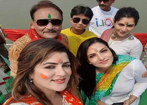 TMC candidate Madan Mitra with BJP nominees aboard a vessel on Hooghly river on Sunday. (Photo | Twitter)