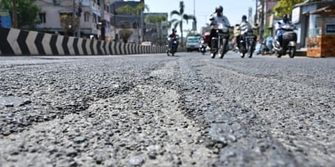 Bumpy roads are the order of the day at Eluru Road in Vijayawada. (Photo| Prasant Madugula, EPS)