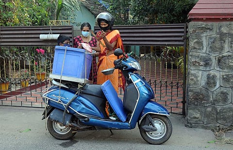 55-year-old Ramani Mani zips through her haunts at Varapuzha, Chenoor and Kadamakudy on her Activa scooter. (Photo | A Sanesh, EPS)