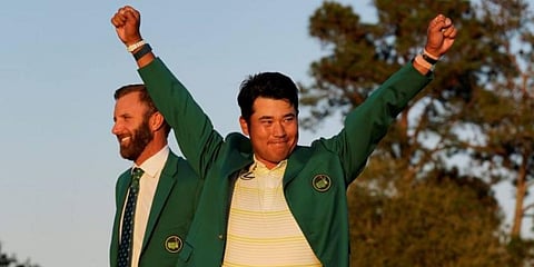 Hideki Matsuyama, of Japan, celebrates after putting on the champion's green jacket after winning the Masters golf tournament on Sunday. (Photo | AP)