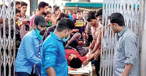 A man injured in clashes during the fourth phase of Bengal elections in Cooch Behar is brought to a hospital. (Photo | PTI)