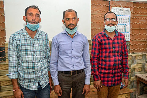 Three persons who were arrested by the police for alleged black marketing of COVID-19 vaccines, in Kanpur, Thursday. (Photo | PTI)