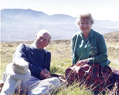 A personal photograph of Queen Elizabeth II and Prince Philip Duke of Edinburgh at the top of the Coyles of Muick, Scotland in 2003. (File Photo | AP)
