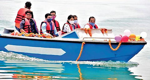 Transport Minister Padmanabha Behera, OTDC chairperson Shreemayee Mishra and other officials enjoying a boat ride in Hirakud Dam reservoir. (Photo| EPS)