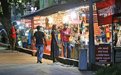 Though the government has introduced stricter norms to curb Covid spread, several shops continue to function till night. A scene from Marine Drive | Arun Angela