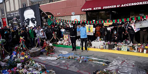 People gather at Cup Foods after a guilty verdict was announced at the trial of Derek Chauvin for the 2020 death of George Floyd. (Photo | AP)