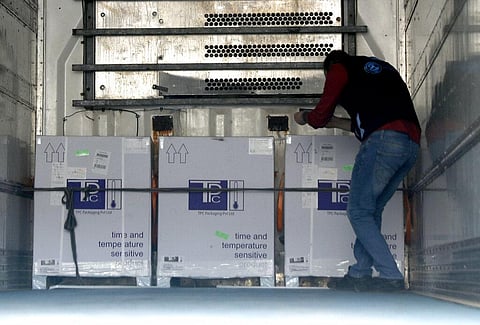 A health worker checks boxes of AstraZeneca COVID-19 vaccines inside a truck, that were delivered to Idlib through a border crossing with Turkey, in Bab Al-Hawa. (Photo | AP)