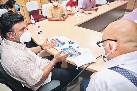 Health Minister Dr K Sudhakar holds a meeting with health department officials and eminent citizens in Bengaluru on Sunday. (Photo | Express)