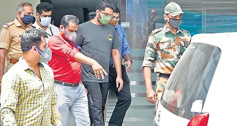 File photo of NIA team, along with gold smuggling case accused Sarith Kumar, leaving a residential apartment near Secretariat in Thiruvananthapuram after evidence collection on Tuesday | B P Deepu