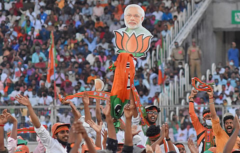 Jubilant workers greeting Prime Minister Narendra Modi during the NDA’s election rally at the Karyavattom Greenfield Stadium in Thiruvananthapuram on Friday. (Photo | B P Deepu, EPS)