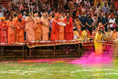 Priests perform rituals at Har Ki Pauri Ghat on the banks of Ganga river, during Kumbh Mela 2021 in Haridwar, Tuesday, April 6, 2021. (Photo | PTI)