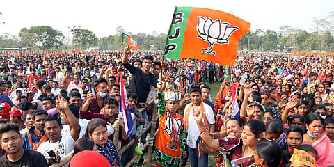 BJP supporters holding party flags