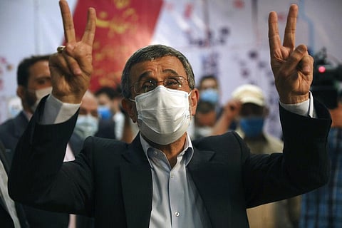 Former President Mahmoud Ahmadinejad flashes victory sign while registering his name as a candidate for the June 18, presidential elections in Tehran. (Photo | AP)