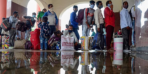 Passengers stand in a queue to register for COVID-19 test, at a railway station. (Photo | PTI)