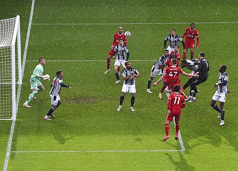 Liverpool's goalkeeper Alisson, second right, scores his side's second goal during the English Premier League soccer match between West Bromwich Albion and Liverpool (Photo | AP)