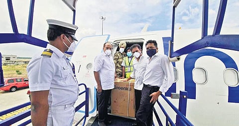 MAUD Minister KT Rama Rao, along with Chief Secretary Somesh Kumar, receives the oxygen concentrators donated by Greenko at the Shamshabad Airport in Hyderabad on Sunday.