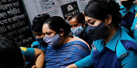 Bangladeshi journalist Rozina Islam, center, is escorted by police to a court in Dhaka, Bangladesh, Tuesday, May 18, 2021. (Photo | AP)