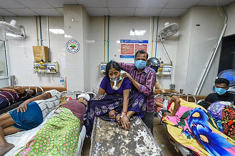 COVID-19 patients share beds and medical oxygen at LLR Hospital, amid a shortage in supplies due to surging coronavirus cases across the country, in Kanpur. (Photo | PTI)