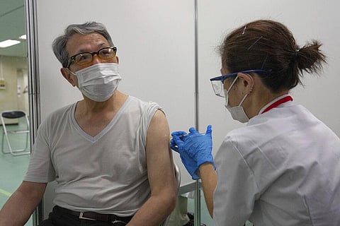 A pensioner receives a shot of the Moderna coronavirus vaccine at the newly-opened mass vaccination center in Tokyo Monay, May 24, 2021. (Photo | AP)