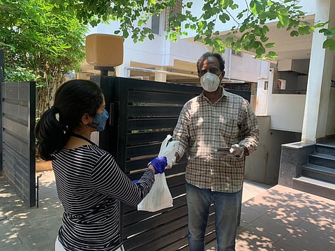 Volunteers in Bengaluru delivering freshly cooked food to COVID patients and their families. (Photo | Special Arrangement)